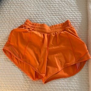 Bright orange Lulu lemon shorts